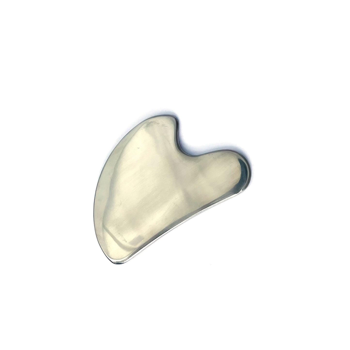 El gua Sha de Acero Inoxidable de Simple As con fondo plano.